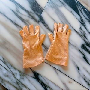 Pink fingerless gloves. Great for driving, compression or just a vibe.